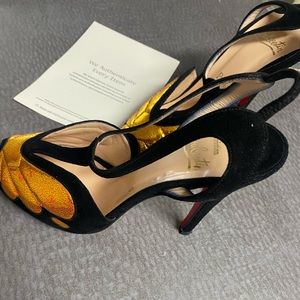 Christian Louboutin  black and gold shoes